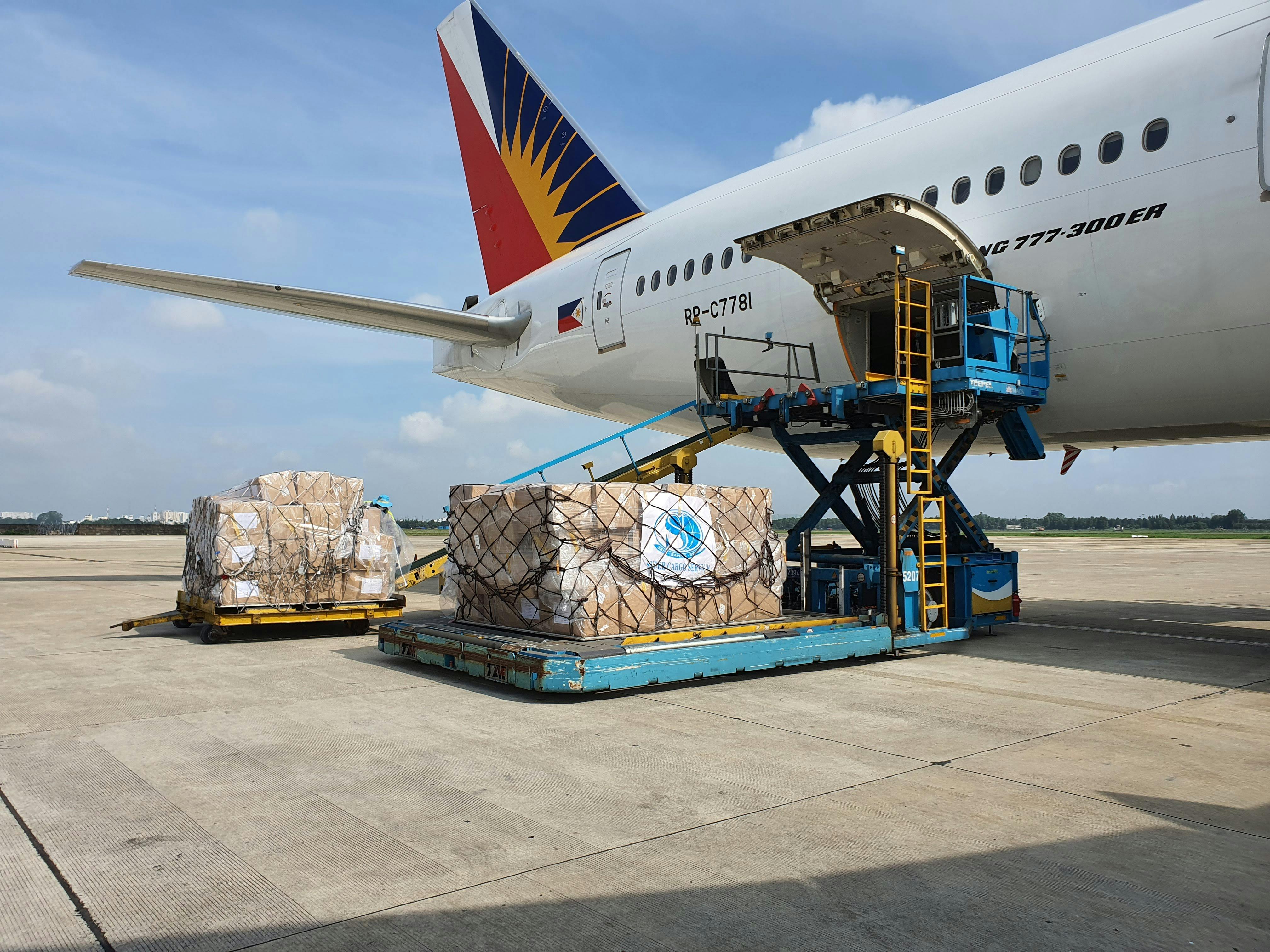 Commercial cargo being loaded onto aircraft at Ho Chi Minh City, Tan Son Nhat International Airport